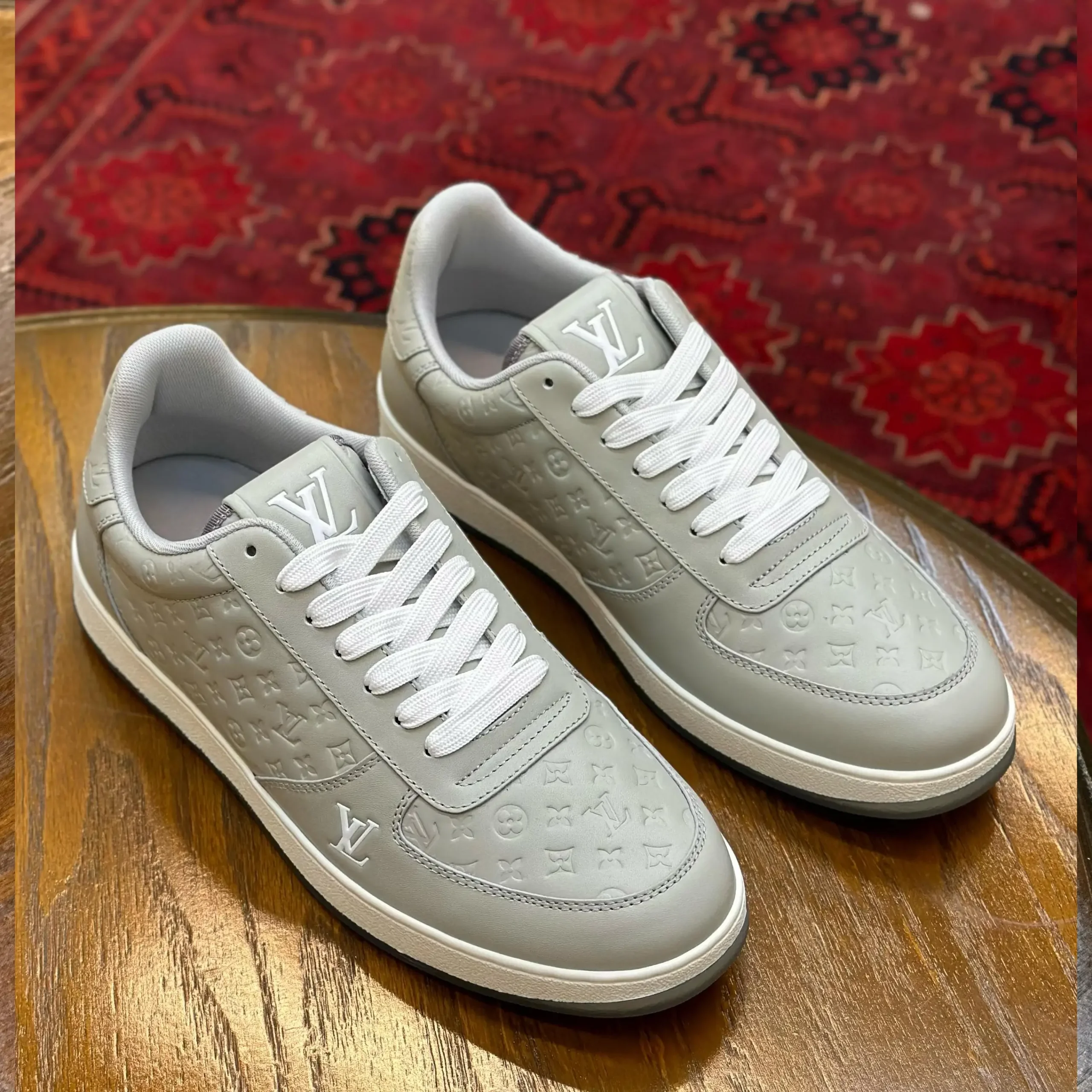 Louis Vuitton Rivoli Sneakers – Monogram-Embossed Leather Luxury Footwear in Dubai UAE