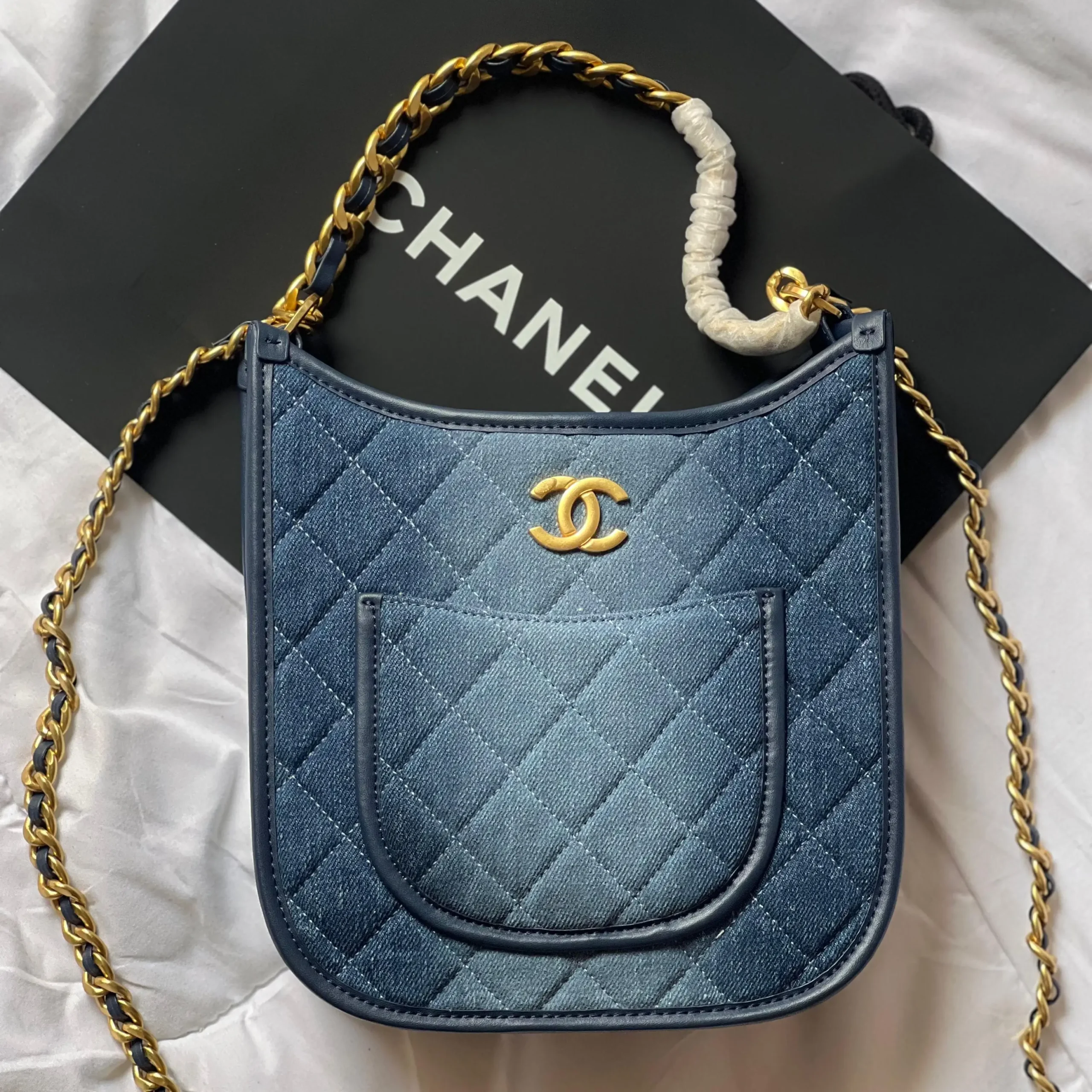 Chanel 24S Hobo Bag – Quilted Denim with silver Chain and Versatile Wear in Dubai UAE Chanel 24S Hobo Bag – Quilted Denim with silver Chain and Versatile Wear in Dubai UAE