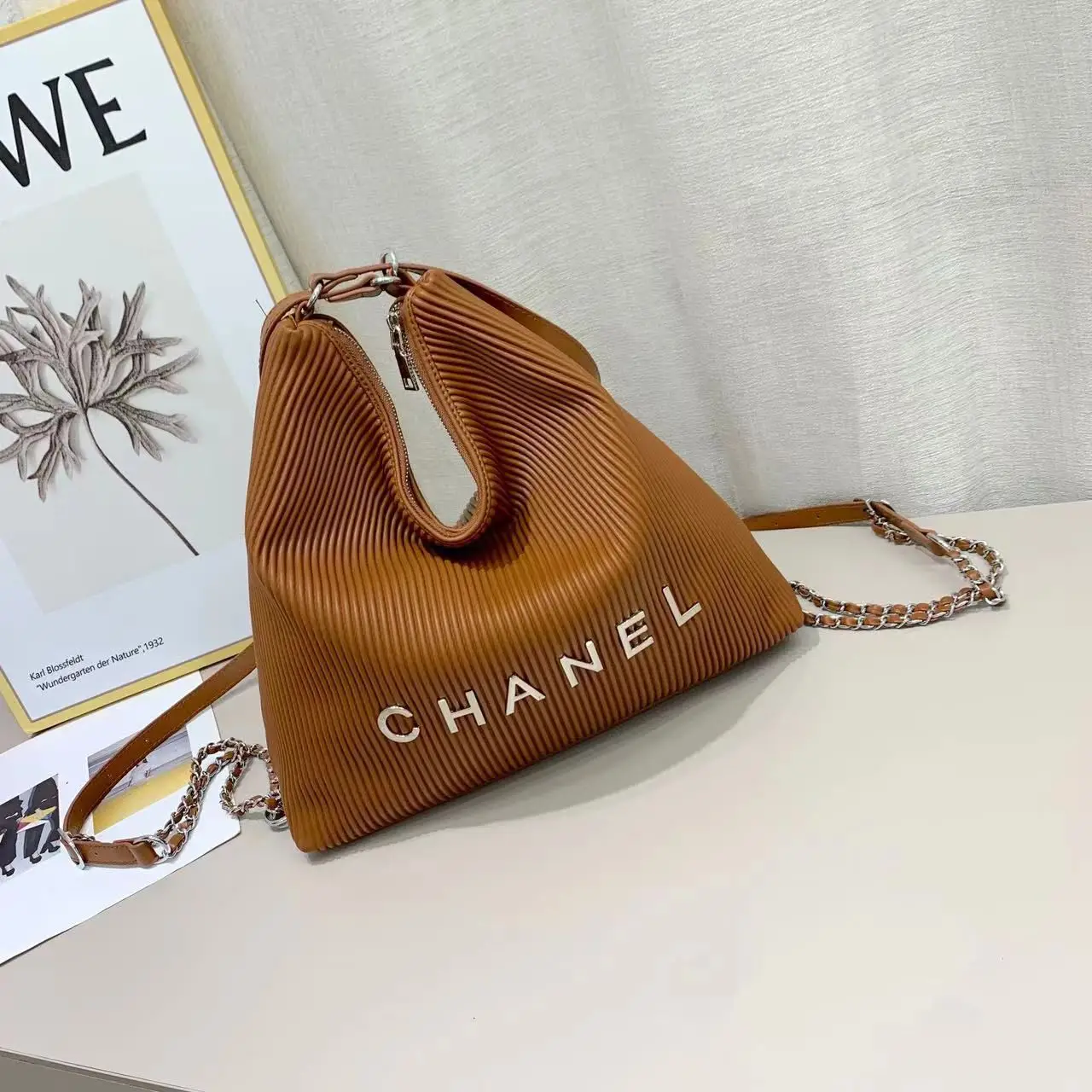 Chanel-Inspired Pleated Brown Bucket Bag with Chain Strap - Spacious & Stylish in Dubai UAE Chanel-Inspired Pleated Brown Bucket Bag with Chain Strap - Spacious & Stylish in Dubai UAE