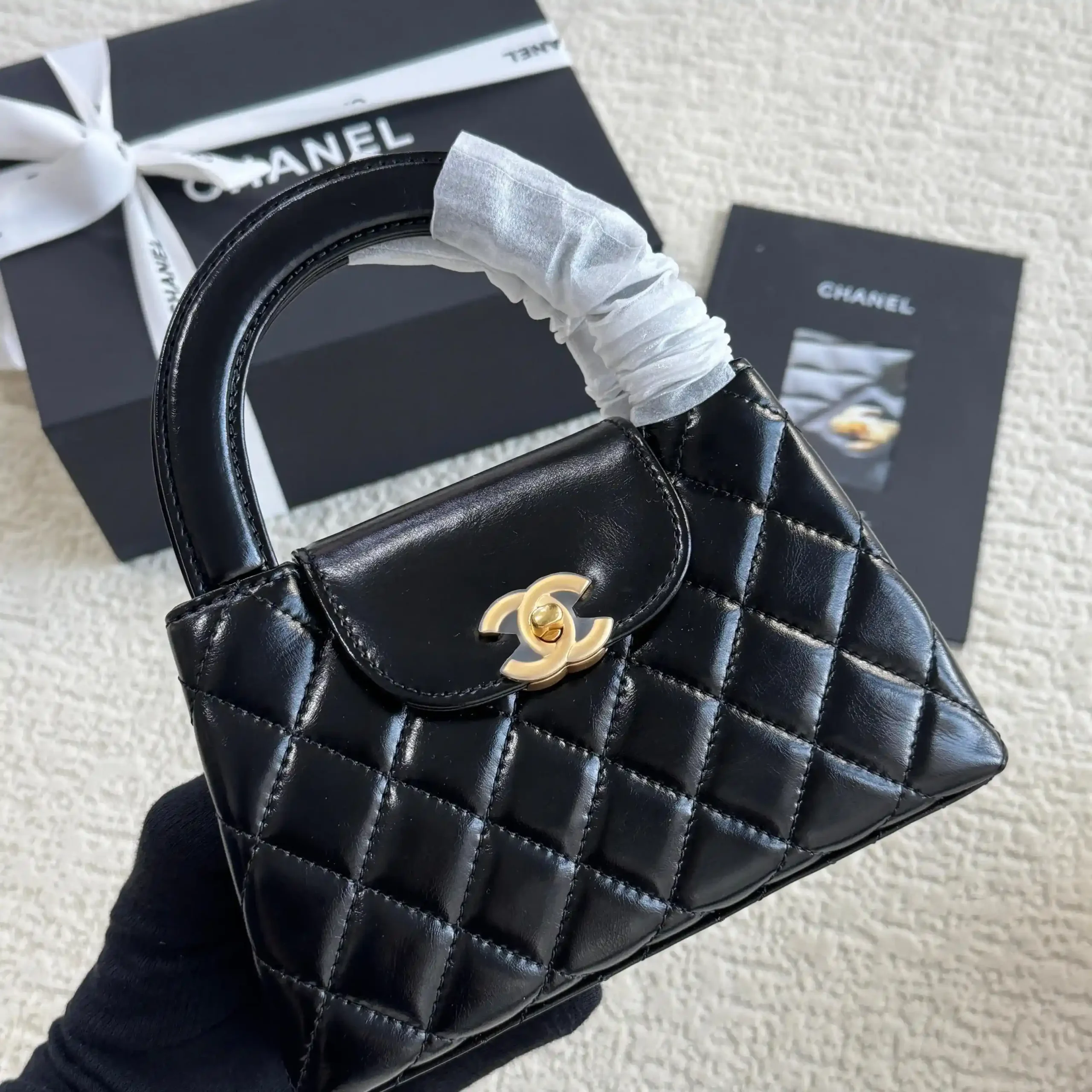 Chanel Mini Kelly Bag in Black Lambskin with Silver CC Lock – Iconic Elegance & Luxury in Dubai UAE Chanel Mini Kelly Bag in Black Lambskin with Silver CC Lock – Iconic Elegance & Luxury in Dubai UAE