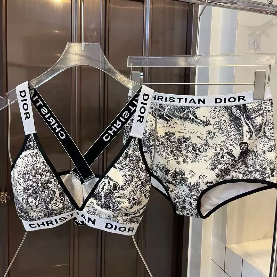 Christian Dior Two-Piece Bikini Set – Black & White Jungle Print with Logo Band in Dubai UAE Christian Dior Two-Piece Bikini Set – Black & White Jungle Print with Logo Band in Dubai UAE