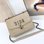 Dior Saddle Bag in Beige Canvas with Chain Strap – Iconic Designer Handbag in Dubai UAE