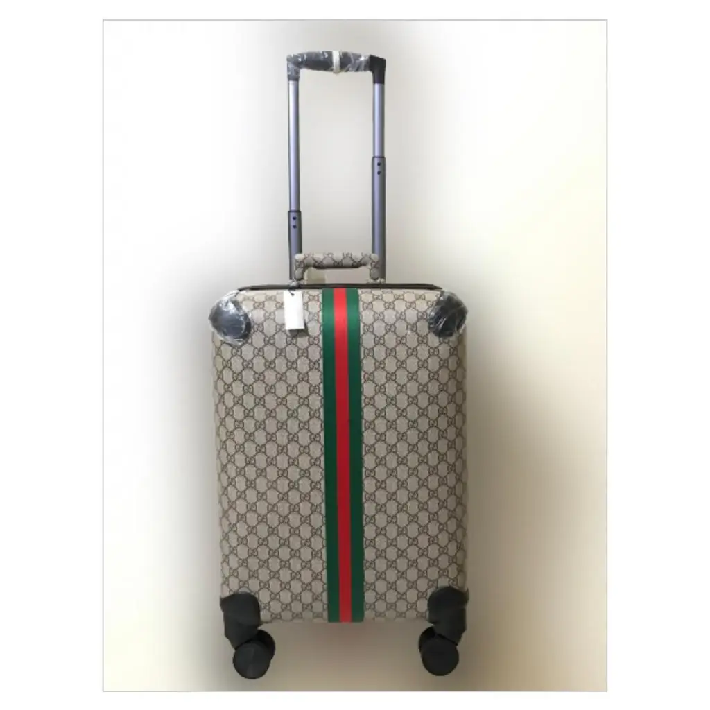 Gucci Cabin Trolley – Luxury GG Monogram Travel Suitcase in Aluminum or GG Supreme Canvas in Dubai UAE Gucci Cabin Trolley – Luxury GG Monogram Travel Suitcase in Aluminum or GG Supreme Canvas in Dubai UAE