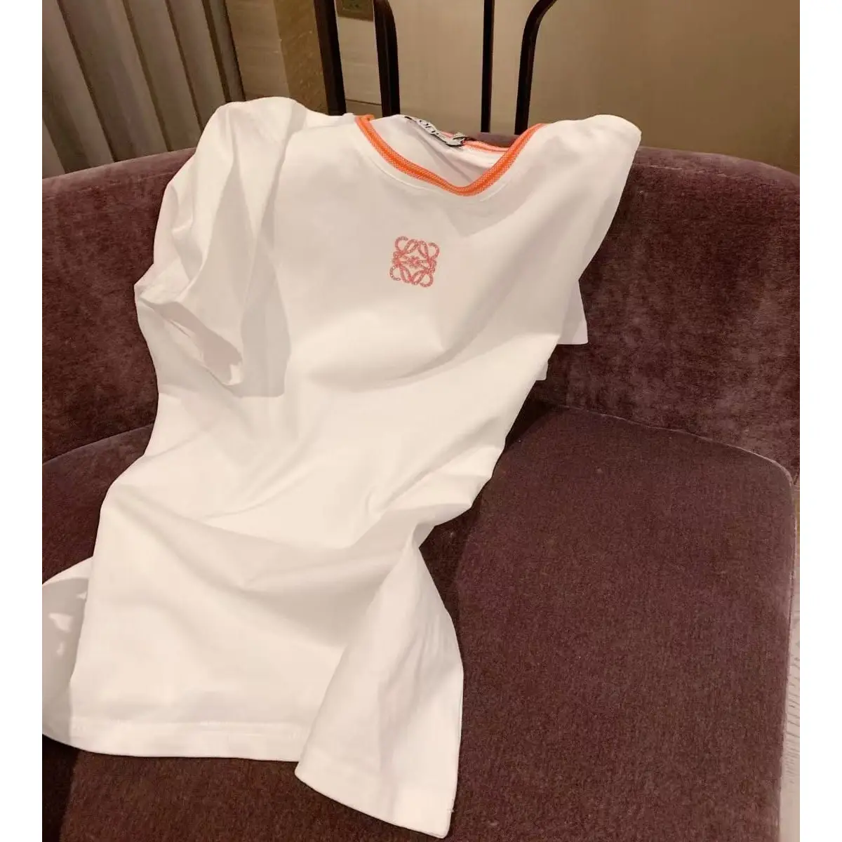 Loewe White Short-Sleeved T-Shirt with Orange Trim and Anagram Logo in Dubai UAE Loewe White Short-Sleeved T-Shirt with Orange Trim and Anagram Logo in Dubai UAE