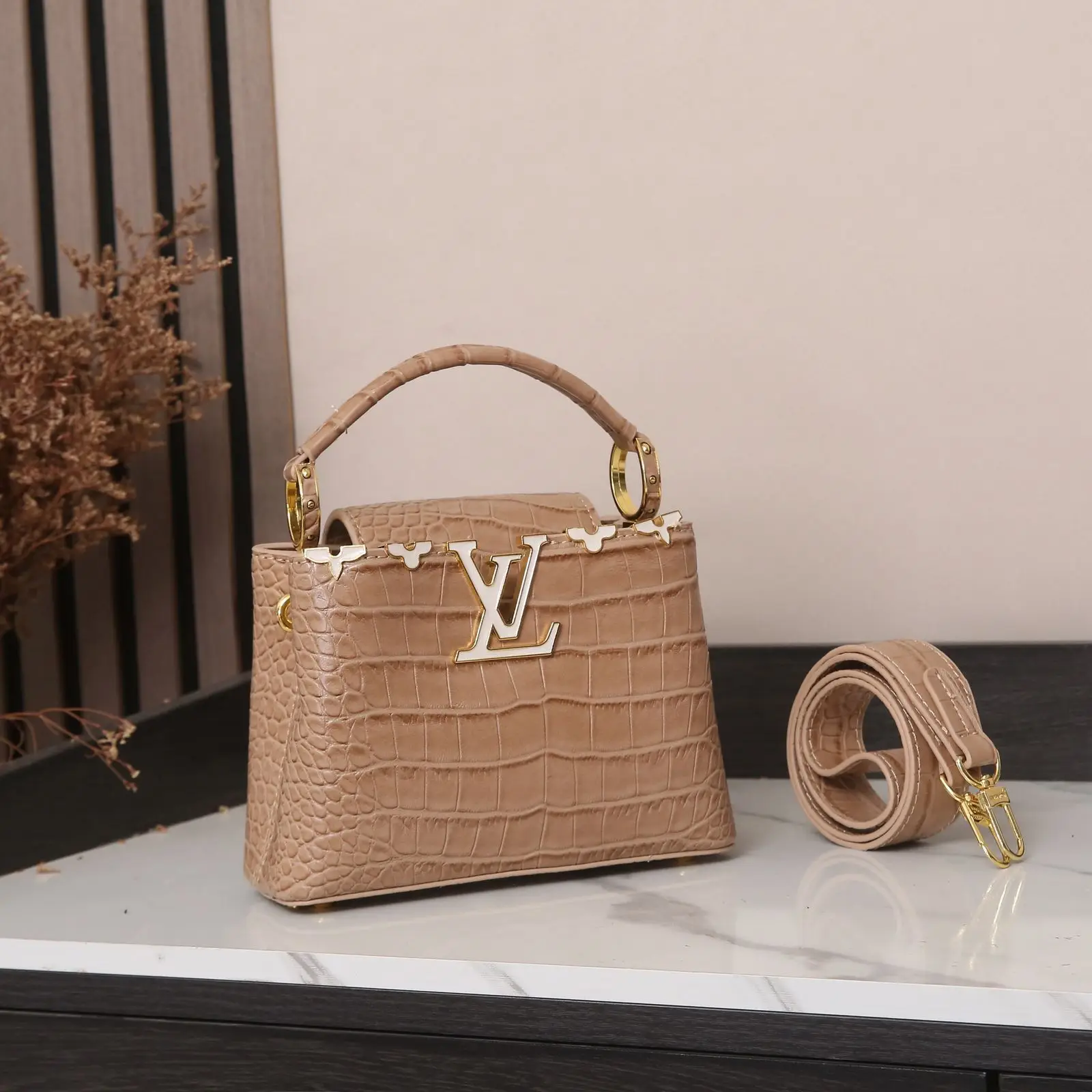 Louis Vuitton Capucines Handbag – Elegant Full-Grain Taurillon Leather with Signature LV Flap in Dubai UAE Louis Vuitton Capucines Handbag – Elegant Full-Grain Taurillon Leather with Signature LV Flap in Dubai UAE