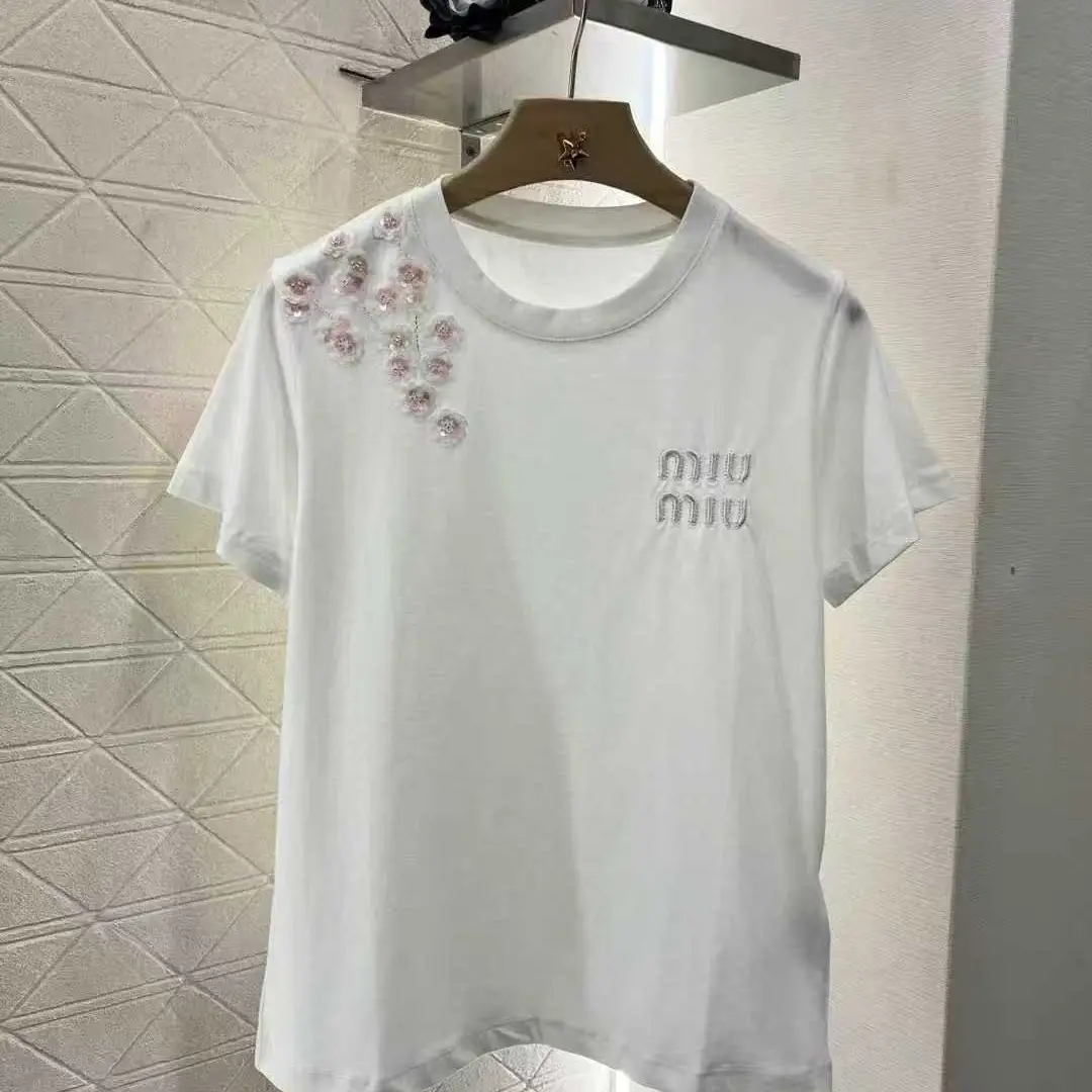 Miu Miu Logo T-Shirt – Iconic Short-Sleeved Designer Tee for Women in Dubai UAE Miu Miu Logo T-Shirt – Iconic Short-Sleeved Designer Tee for Women in Dubai UAE
